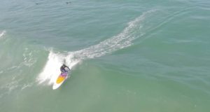 Surfing-with-the-custom-GLIDE-Stand-Up-Paddle-board