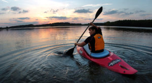 Katherine Brady of Danville, Pa. has Lake Chillisquaque at the Montour Preserve in White Hall, Pa., to herself as she pushes off from the shore in her kayak as the sun sets Monday evening, Oct. 1, 2007. (AP Photo/Bloomsburg Press Enterprise, Jimmy May)